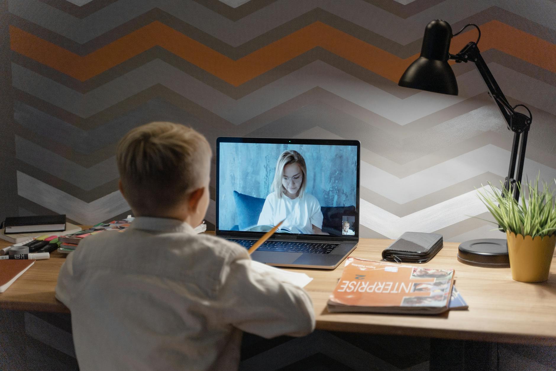 a boy attending an online class