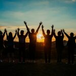 people silhouette during sunset